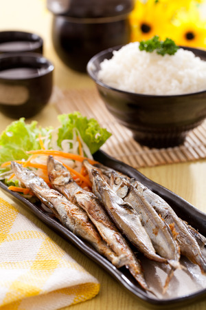 Grilled shishamo with rice in Japanese restaurantsの写真素材