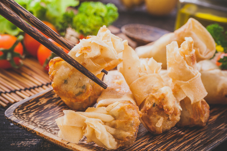Fried chinese spring rolls with sweet chili sauce.の写真素材
