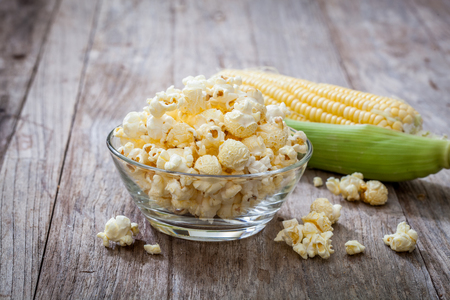 Popcorn in bowl with sweet cornの写真素材