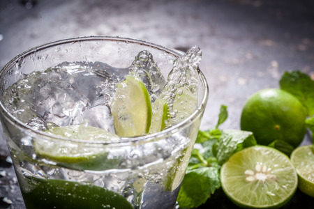 Splashing lemon juice with mintの写真素材