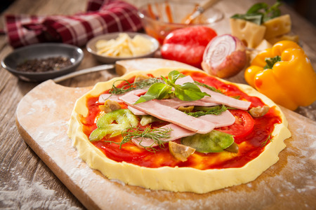 Food ingredients for pizza on tableの写真素材