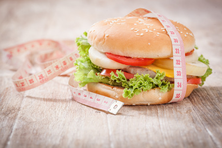 Cheese hamburger with measuring tapeの写真素材