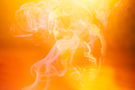Scary Halloween skull bones with smokeの写真素材