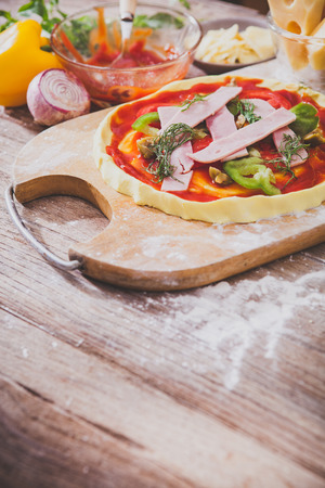 Food ingredients for pizza on tableの写真素材