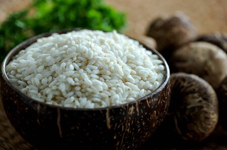 Risotto rice grains with mushroomsの写真素材