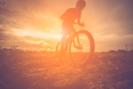 Silhouette of mountain bike ridesの写真素材
