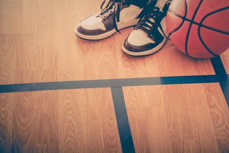 Basketball court with ball and shoesの写真素材