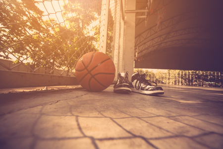 Basketball court with ball and shoesの写真素材