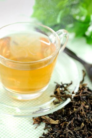 Cup with green tea on tableの写真素材