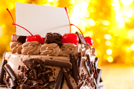 Chocolate cake and blank business cardsの写真素材