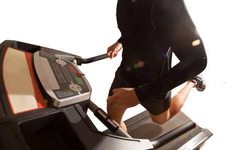 Man running in a gym on a treadmill