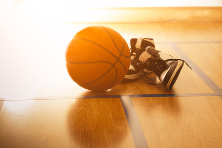 Basketball court with ball and shoesの写真素材