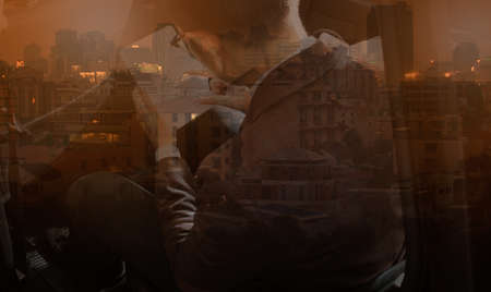 Multi-layered effect businessman sitting with a tabletの写真素材