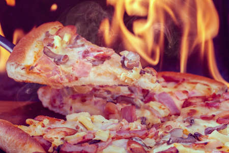 Delicious italian pizzas served on ovenの写真素材