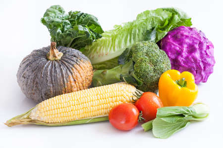 Colorful raw vegetables on white background