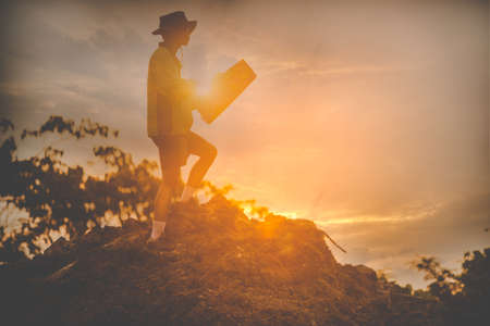 Man with map exploring on trekking adventure
