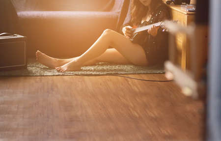 Asian woman  studying music at home.の写真素材