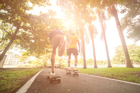 skateboarders  skating active performance on a skateboard at parkの写真素材