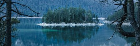 Winter landscape with lake and mountains, Zugspitze, Aibsee, Germanyの写真素材