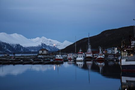 Boats in a winter fjord in Norwayの写真素材