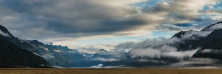 eglinton valley open view with grassland in the foreground along the way of milford road in new zealand.の写真素材