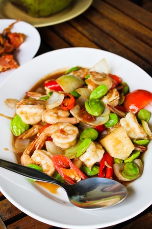 fried shrimp with red chillies,tomatoes and stinky beansの写真素材