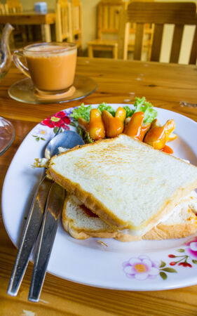 sausage with eggs and bread for breakfastの写真素材