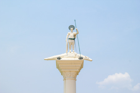 statue of a man standing on crocodileの写真素材