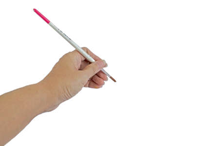 left hand with brushの写真素材