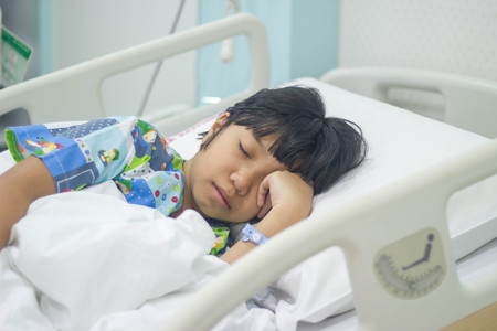 sick gril in hospital bedの写真素材