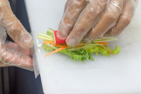 chief making salad rollの写真素材