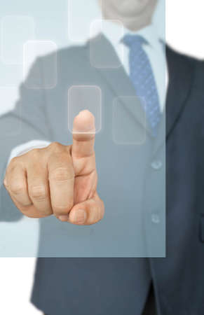 Business man touching an imaginary screen or buttonの写真素材