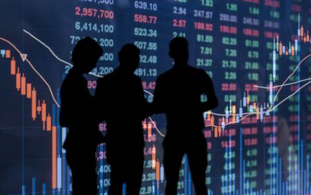 silhouette photo of businessman and businesswoman on  stock market price background