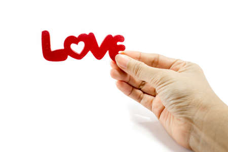 hand hold love word isolated on white background: in the  concept of sustain loveの写真素材