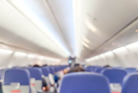 blurred photo of passenger walking in the airplaneの写真素材