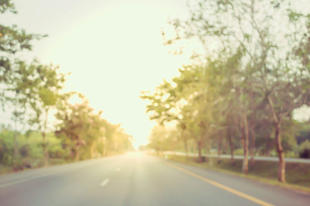 abstract bokeh blur photo of the road and sun light in warm retro filterの写真素材