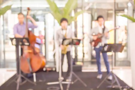 abstract blurred photo of  musicians band with instrumentsの写真素材