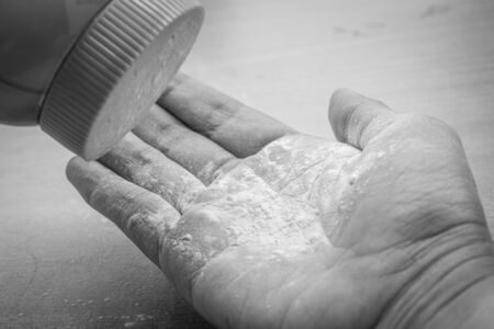 white talcum powder on the wood floor in black and whiteの写真素材