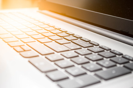 Blur Laptop with soft sun light from left sideの写真素材
