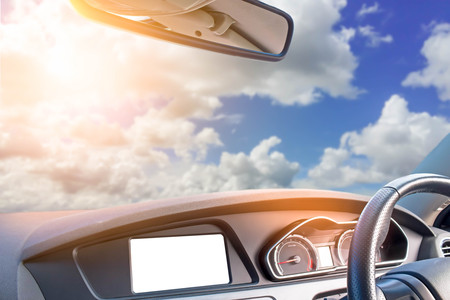 modern car with beautiful sky and soft sunlightの写真素材