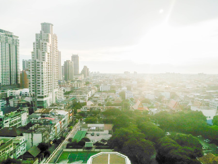 blurred city building in Bangkok with sunlightの写真素材
