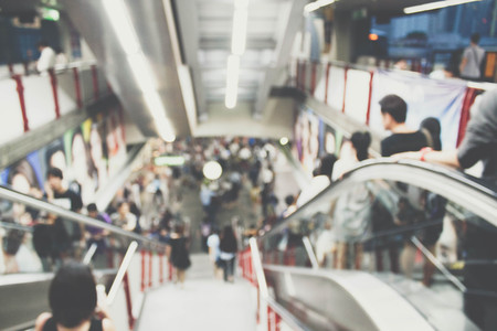 abstract blurred photo of people on escalatorの写真素材