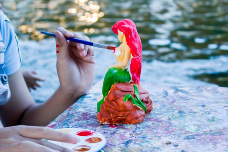 hand of girl painting art craftの写真素材