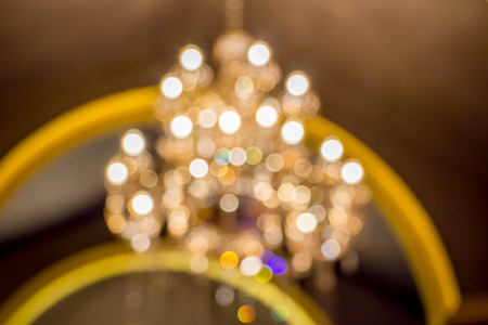 abstract blurred bokeh of chandelier at shopping mall or hallの写真素材