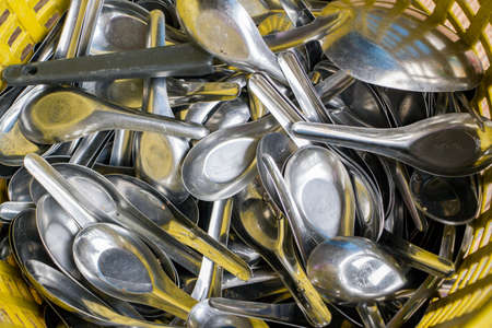 texture backgroud of silver spoon in basketの写真素材