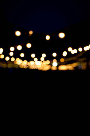 abstract blurred bokeh of light over dark background