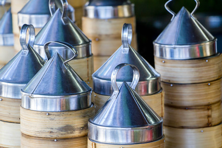 a pile of bamboo steamer with steel cover for Dim Sum : traditional Chinese foodの写真素材