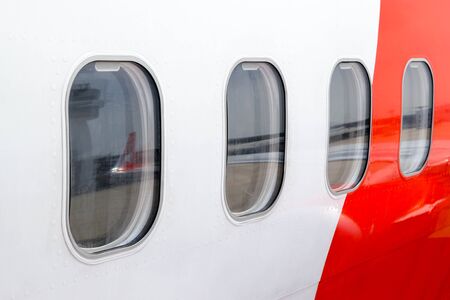 airplane window from the outside at the airportの写真素材