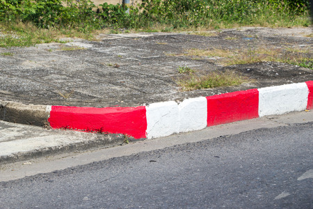 White and red strip no parking Sign on footpath roadの写真素材