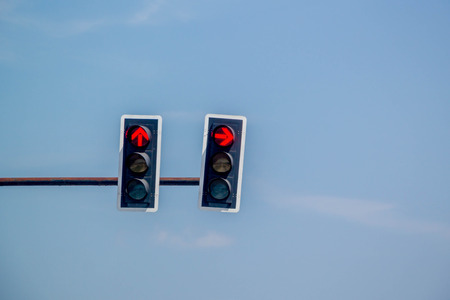 red arrow traffic light on blue sky backgroundの写真素材